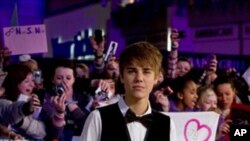 US singer Justin Bieber arrives for the European premiere of his film 'Never Say Never', Wednesday, Feb. 16, 2011, held at the o2 in London. (AP Photo/Joel Ryan)