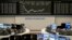 The curve of the German stock index DAX is seen at the stock market in Frankfurt, Germany, Tuesday, March 17, 2020.