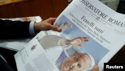 The front page of the Vatican newspaper, L'Osservatore Romano shows Pope Francis with his latest encyclical titled "Fratelli Tutti" (Brothers All) at the Vatican, Oct. 4, 2020.