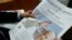 The front page of the Vatican newspaper, L'Osservatore Romano shows Pope Francis with his latest encyclical titled "Fratelli Tutti" (Brothers All) at the Vatican, Oct. 4, 2020.