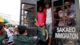 Cambodian migrant workers get off from a Thai truck upon their arrival from Thailand at Cambodia-Thai international border gate in Poipet, Cambodia, Tuesday, June 17, 2014. The number of Cambodians who have returned home from Thailand this month after a threatened crackdown on foreigners working illegally has topped 160,000, a Cambodian official said Monday. Thai officials insist the cross-border movement is voluntary and is not forced repatriation. They say Thai military and government resources were used to transport workers who decided to return home after being laid off because they were working illegally. (AP Photo/Heng Sinith)