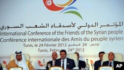 Tunisian foreign minister Rafik Abdessalem, center, opens the Conference on Syria in Tunis, Tunisia, February 24, 2012.