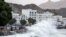 High waves break on the Mutrah seaside promenade in the Omani capital, Muscat, on Oct. 2, 2021, as Tropical Cyclone Shaheen hits the country.