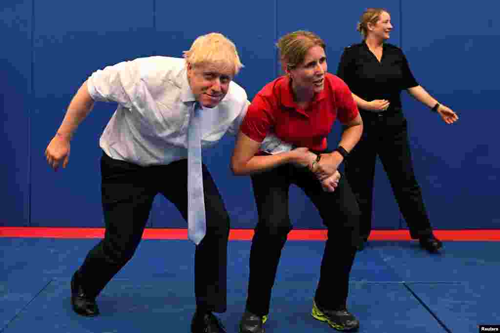 Boris Johnson, a leadership candidate for Britain's Conservative Party, reacts as he visits the Thames Valley Police Training Centre in Reading, Britain.