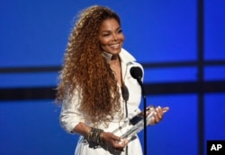 FILE - Janet Jackson accepts the ultimate icon: music dance visual award at the BET Awards at the Microsoft Theater in Los Angeles, June 28, 2015.