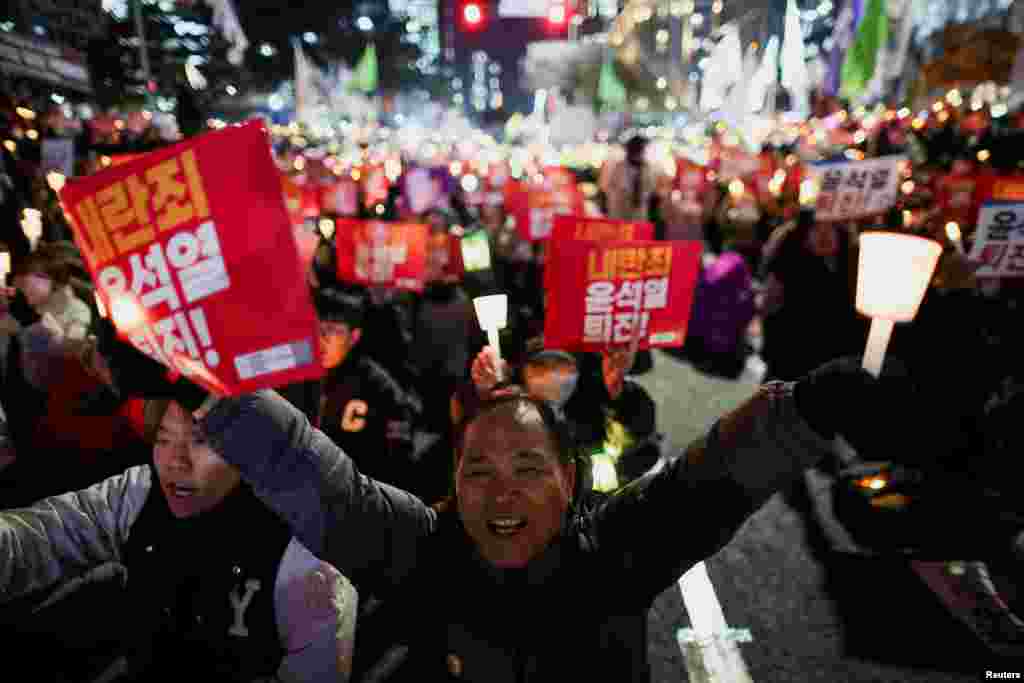 Protesters demanding the impeachment of South Korean President Yoon Suk Yeol, who declared martial law, which was reversed hours later, gather in front of the National Assembly in Seoul, South Korea.