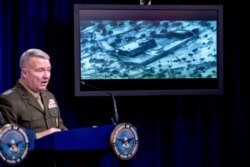 Video of the Abu Bakr al-Baghdadi raid is displayed as U.S. Central Command Commander Marine Gen. Kenneth McKenzie speaks, Oct. 30, 2019, at a joint press briefing at the Pentagon in Washington.