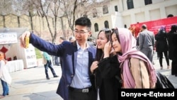 Chinese tourists take a selfie in Iran in this undated photo published by the Donya-e-Eqtesad newspaper in December 2019 (Credit: Donya-e-Eqtesad)
