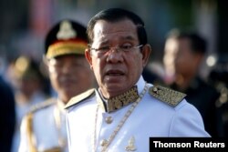 FILE - Cambodia's Prime Minister Hun Sen arrives at the Independence Monument to attend celebrations marking the 65th anniversary of the country's independence from France, in Phnom Penh, Cambodia, Nov. 9, 2018.