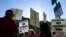 Public school teachers picket outside Amundsen High School in Chicago on the first day of a strike by the Chicago Teachers Union, Monday, Sept. 10, 2012.