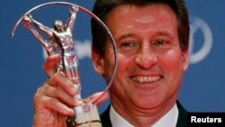 Sebastian Coe, chairman of the organizing committee for the London Olympics, poses with his Laureus Lifetime Achievement Award during the 2013 Laureus World Sports Awards, at Municipal Theater in Rio de Janeiro March 11, 2013.