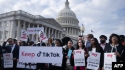 FILE - People gather for a press conference about their opposition to a TikTok ban, on Capitol Hill in Washington, March 22, 2023.