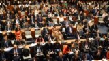 FILE - Delegates attend the UN Climate Ambition Summit on the sidelines of the 78th United Nations General Assembly at UN headquarters in New York City on September 20, 2023.