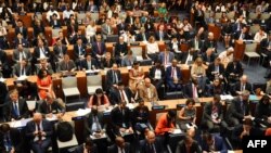 FILE - Delegates attend the UN Climate Ambition Summit on the sidelines of the 78th United Nations General Assembly at UN headquarters in New York City on September 20, 2023.