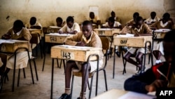 FILE - Pupils from the Mathare North Primary School take the Kenya Certificate of Primary Education (KCPE) exam.