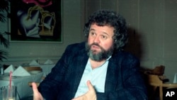 FILE - This 1990 file photo shows director of photography Allen Daviau speaking during an interview in Los Angeles. Daviau, who shot three of Steven Spielberg’s films, died April 14, 2020.