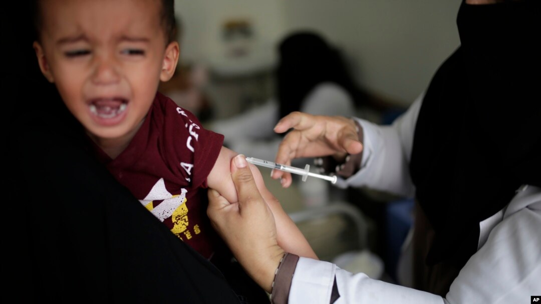 A boy reacts as he receives a diphtheria vaccine at a hospital in Sanaa, Yemen, Sept. 9, 2019. 