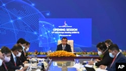 Cambodian Prime Minister Hun Sen, center, attends during an online opening session of the Asia-Europe Meeting (ASEM) in Phnom Penh, Cambodia, Thursday, Nov. 25, 2021. (An Khoun Sam Aun/Ministry of Information of Cambodia via AP)