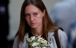 FILE - Russian journalist Svetlana Prokopyeva, charged with publicly justifying terrorism, arrives for a court hearing in Pskov, Russia, July 6, 2020.