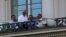 Iranian Foreign Minister Mohammad Javad Zarif and his team meet on a balcony of the Palais Coburg, where nuclear talks are taking place in Vienna, Austria, July 11, 2015.