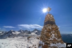 FILE - In this photo provided by the South Tyrol Museum of Archaeology, a memorial stands at the site where "Oetzi the Iceman" was found in the Italian Alps. (Dario Frasson/South Tyrol Museum of Archaeology via AP)