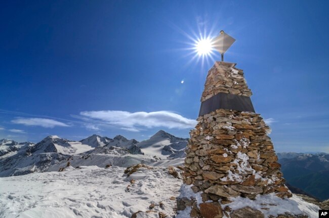 FILE - In this photo provided by the South Tyrol Museum of Archaeology, a memorial stands at the site where "Oetzi the Iceman" was found in the Italian Alps. (Dario Frasson/South Tyrol Museum of Archaeology via AP)