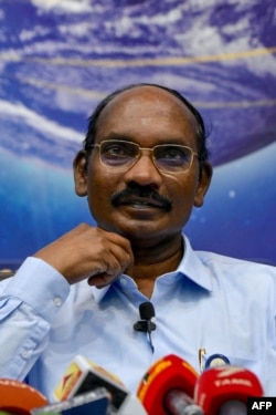 Chairman of the Indian Space Research Organisation (ISRO) Kailasavadivoo Sivan gestures as he announces ISRO's plans for 2020.