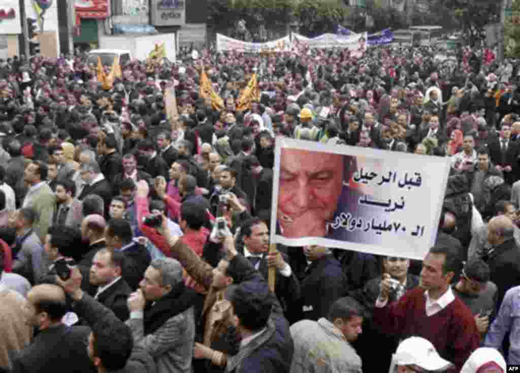 Egyptian lawyers in black robes stream into Cairo's Tahrir Square, Thursday, Feb. 10, 2011. Labor unrest across the country gave powerful momentum to Egypt's wave of anti-government protests. With its efforts to manage the crisis failing, the government t