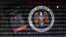 A mobile phone simulating a call to German Chancellor Angela Merkel next to a tablet computer showing the logo of the National Security Agency (NSA) is seen in this multiple exposure picture illustration taken in Frankfurt, Oct. 28, 2013. 
