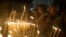 Christian worshipers light candles at the Church of the Nativity, traditionally believed by Christians to be the birthplace of Jesus Christ, ahead of Christmas, in the West Bank city of Bethlehem, Dec. 17, 2017. 