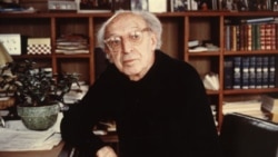 Aaron Copland at home in his library