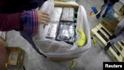 Spanish customs authorities show contents of a record cocaine seizure which was hidden among boxes of bananas in a shipping container in this still image from video in Algeciras, Spain, released April 25, 2018. 