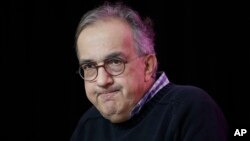 Ferrari CEO Sergio Marchionne speaks to reporters at the New York Stock Exchange in New York, Monday, Oct. 9, 2017. Ferrari is celebrating it's 70th anniversary. (AP Photo/Seth Wenig)