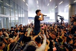 Pro-democracy activist Joshua Wong addresses the crowds outside the Legislative Council during a demonstration demanding Hong Kong's leaders to step down and withdraw the extradition bill, in Hong Kong, China, June 17, 2019.