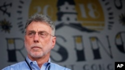 Martin Baron, executive editor of The Washington Post, stands on stage during a benefit concert in Annapolis, Md., on Saturday, July 28, 2018, to honor the Capital Gazette employees killed in a shooting at their newsroom in June.