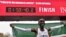 Kenya's Eliud Kipchoge celebrates after breaking the two-hour barrier for the marathon, Oct. 12, 2019, in Vienna. 