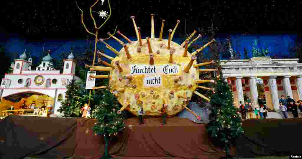 A papier mache model of the coronavirus shows the inscription reading &quot;Do not be afraid&quot; inside the Roman Catholic Church of St. Martinus in Renningen near Stuttgart, Germany.