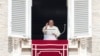 Pope Francis waves during the Angelus noon prayer from the window of his studio overlooking St. Peter's Square, at the Vatican, Sept. 22, 2024. The pope will be traveling to Luxembourg and Belgium Sept. 26-29. 