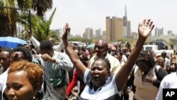 Striking public health workers participate in a demonstration as they enter the Ministry of Health headquarters in Kenya's capital Nairobi, March 9, 2012. 