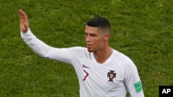 FILE - Portugal's Cristiano Ronaldo leaves the pitch after his team was eliminated during the round of 16 match between Uruguay and Portugal at the 2018 soccer World Cup at the Fisht Stadium in Sochi, Russia, June 30, 2018.