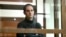 FILE - Wall Street Journal reporter Evan Gershkovich stands in a glass cage in a courtroom at the Moscow City Court, in Moscow, Russia, on Dec. 14, 2023. 