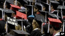 FILE - Students attend graduation ceremonies, Aug. 6, 2011.