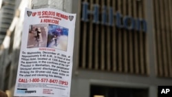 A reward poster hangs on a light pole outside the Hilton Hotel in midtown Manhattan in New York, where Brian Thompson, the CEO of UnitedHealthcare, was fatally shot, Dec. 4, 2024.