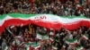 Iranian women cheer during a soccer match between their national team and Cambodia in the 2022 World Cup qualifier, Oct. 10, 2019.