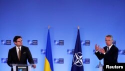 NATO Secretary-General Jens Stoltenberg and Ukrainian Foreign Minister Dmytro Kuleba give a press conference in Brussels, Belgium, Apr. 13, 2021. (Francisco Seco/Pool via Reuters)