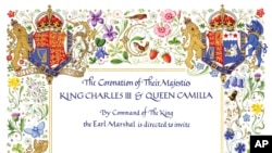 This photo released by Buckingham Palace on Tuesday, April 4, 2023 displays the invitation to the Coronation of Britain's King Charles III in Westminster Abbey. (Buckingham Palace via AP)