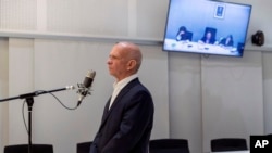 FILE - Retired Maj. Gen. Hugo Carvajal speaks during an extradition hearing at the National Court in Madrid, Spain, Sept. 12, 2019.