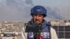 FILE - A Palestinian journalist uses his mobile phone to broadcast live in Rafah on the southern Gaza Strip, Dec. 27, 2023, amid battles between Israel and Hamas.