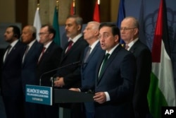 Spanish Foreign Minister Jose Manuel Albares speaks next to Palestinian Prime Minister Mohammad Mustaf, right, and European Union foreign policy chief Josep Borrell, third from right, during a meeting of European and Muslim nations in Madrid, Spain, Sept. 13, 2024.