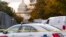 FILE - Washington Metropolitan Police investigate near the Supreme Court and Capitol after reports of a suspicious vehicle in which two men and a woman were detained with guns, Oct. 19, 2022.